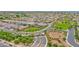 Community aerial shot showcasing mature landscaping, a gated entrance, and tree-lined streets at 3842 E Fountain St, Mesa, AZ 85205