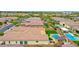 Aerial view of a well-maintained backyard with a pool, outdoor dining, and lush landscaping in a gated community at 3842 E Fountain St, Mesa, AZ 85205