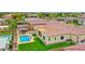 Backyard aerial view featuring a sparkling pool, lush landscaping, and an outdoor dining area, perfect for entertaining at 3842 E Fountain St, Mesa, AZ 85205