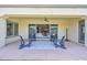 Covered back patio with stylish seating, perfect for enjoying outdoor living and entertaining guests at 3842 E Fountain St, Mesa, AZ 85205
