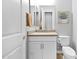 Bathroom with a sink, neutral countertops, white cabinets and new toilet at 3842 E Fountain St, Mesa, AZ 85205