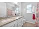 Hall bathroom featuring double sinks, a shower/tub, and modern fixtures at 3842 E Fountain St, Mesa, AZ 85205