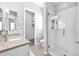 Bright bathroom featuring a glass shower, neutral countertops, and a spacious closet at 3842 E Fountain St, Mesa, AZ 85205