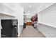 Walk-in closet featuring a safe, custom shelving, and ample storage space at 3842 E Fountain St, Mesa, AZ 85205