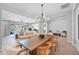 Spacious dining area seamlessly connected to the living room, offering an open and airy atmosphere with backyard views at 3842 E Fountain St, Mesa, AZ 85205