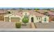 Charming home with a tile roof, well-manicured landscaping, and a two-car garage at 3842 E Fountain St, Mesa, AZ 85205