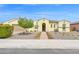 Charming Southwestern-style home featuring a gated front entry, desert landscaping, and well-manicured front yard at 3842 E Fountain St, Mesa, AZ 85205