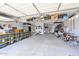 Spacious garage with overhead storage racks and extra space for motorcycles and tools at 3842 E Fountain St, Mesa, AZ 85205