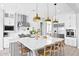 Bright kitchen with stainless steel appliances, white cabinetry, and a large island at 3842 E Fountain St, Mesa, AZ 85205