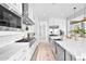Stylish kitchen with stainless steel appliances, white cabinets, and a sleek design at 3842 E Fountain St, Mesa, AZ 85205
