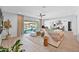 Inviting living room with large windows to the outdoor pool, cozy seating, and neutral tones throughout at 3842 E Fountain St, Mesa, AZ 85205