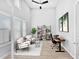 Bright home office featuring tall ceilings, modern furniture, and lots of natural light at 3842 E Fountain St, Mesa, AZ 85205