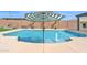 Refreshing pool featuring a charming umbrella and fountain features, surrounded by well-manicured landscaping at 3842 E Fountain St, Mesa, AZ 85205
