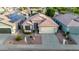 An aerial view of a home featuring a terracotta roof, desert landscaping, and a two-car garage at 3907 E Topeka Dr, Phoenix, AZ 85050