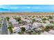 Expansive aerial view showcasing a peaceful residential neighborhood with well-maintained homes and community streets at 3907 E Topeka Dr, Phoenix, AZ 85050