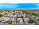 An aerial view of a neighborhood and the surrounding mountains at 3907 E Topeka Dr, Phoenix, AZ 85050