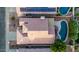 Aerial view of a private backyard oasis featuring a sparkling pool, patio, and lush landscaping at 3907 E Topeka Dr, Phoenix, AZ 85050