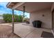 A covered backyard patio featuring outdoor furniture and a grill near the swimming pool at 3907 E Topeka Dr, Phoenix, AZ 85050