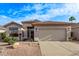 Charming single-story home featuring a well-maintained front yard and a two-car garage at 3907 E Topeka Dr, Phoenix, AZ 85050