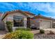 Charming single-story home featuring a well-maintained front yard and a two-car garage at 3907 E Topeka Dr, Phoenix, AZ 85050