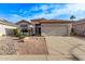 Charming single-story home featuring a well-maintained front yard and a two-car garage at 3907 E Topeka Dr, Phoenix, AZ 85050