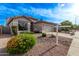 Charming single-story home with a well-maintained front yard and a two-car garage at 3907 E Topeka Dr, Phoenix, AZ 85050