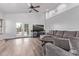 Bright living room with high ceilings, wood floors, and access to backyard at 3907 E Topeka Dr, Phoenix, AZ 85050