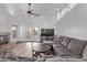 Bright living room with high ceilings, wood floors, fireplace, and access to backyard at 3907 E Topeka Dr, Phoenix, AZ 85050