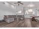 Spacious living room with a vaulted ceiling, fireplace, and a game table at 3907 E Topeka Dr, Phoenix, AZ 85050