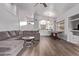 Open-concept living room featuring high ceilings, wood floors, and game table at 3907 E Topeka Dr, Phoenix, AZ 85050