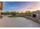 Outdoor space includes a fireplace, pool, and view of golf course at 41424 N Club Pointe Dr, Anthem, AZ 85086