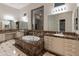 The bathroom has dual sinks, soaking tub, and generous counter space at 41424 N Club Pointe Dr, Anthem, AZ 85086