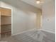 Comfortable bedroom featuring plush neutral carpeting and convenient closet access at 41424 N Club Pointe Dr, Anthem, AZ 85086