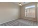 Inviting bedroom featuring a ceiling fan and plantation shutters for natural light at 41424 N Club Pointe Dr, Anthem, AZ 85086