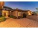 Paver driveway with desert landscaping and a warm-toned exterior at 41424 N Club Pointe Dr, Anthem, AZ 85086