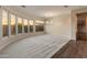 Spacious living room featuring carpet and hardwood floors and sunset views at 41424 N Club Pointe Dr, Anthem, AZ 85086