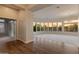Spacious living room with carpet and hardwood floors and large windows with mountain views at 41424 N Club Pointe Dr, Anthem, AZ 85086