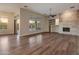 Spacious living room features a modern fireplace, large windows, and bright, open floor plan at 41424 N Club Pointe Dr, Anthem, AZ 85086