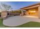 Outdoor patio features a fireplace and outdoor kitchen, perfect for entertaining at 41424 N Club Pointe Dr, Anthem, AZ 85086