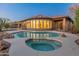 Sparkling pool and spa with view of beautiful home exterior at 41424 N Club Pointe Dr, Anthem, AZ 85086