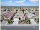 An aerial view of a suburban neighborhood featuring well-maintained homes and landscaping in a Gathering-friendly community at 4148 W Dayflower Dr, San Tan Valley, AZ 85144