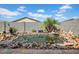 Backyard water garden full of beautiful koi with lush plant life and rock features at 4148 W Dayflower Dr, San Tan Valley, AZ 85144