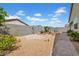 Spacious backyard with brick patio and decorative rock landscaping at 4148 W Dayflower Dr, San Tan Valley, AZ 85144