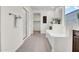 Well-lit bathroom featuring a walk-in shower, a soaking tub, and a marble-floored walk-in closet at 4148 W Dayflower Dr, San Tan Valley, AZ 85144