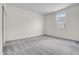 Bright, empty bedroom with a carpeted floor and a window offering natural light at 4148 W Dayflower Dr, San Tan Valley, AZ 85144