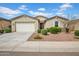 Charming single-story home featuring a two-car garage and low maintenance desert landscaping in the front yard at 4148 W Dayflower Dr, San Tan Valley, AZ 85144