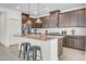 Stylish kitchen with pendant lighting, stainless steel appliances and a large island with bar seating at 4148 W Dayflower Dr, San Tan Valley, AZ 85144