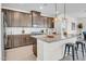 Bright kitchen featuring a large island with pendant lights, stainless appliances and plenty of storage at 4148 W Dayflower Dr, San Tan Valley, AZ 85144