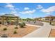 A community park offering shaded picnic spots, barbecue grills, and inviting gravel paths for outdoor enjoyment at 4148 W Dayflower Dr, San Tan Valley, AZ 85144