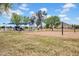 A beautiful park equipped with play structures, picnic areas, and a volleyball court, perfect for Gathering fun and outdoor activities at 4148 W Dayflower Dr, San Tan Valley, AZ 85144